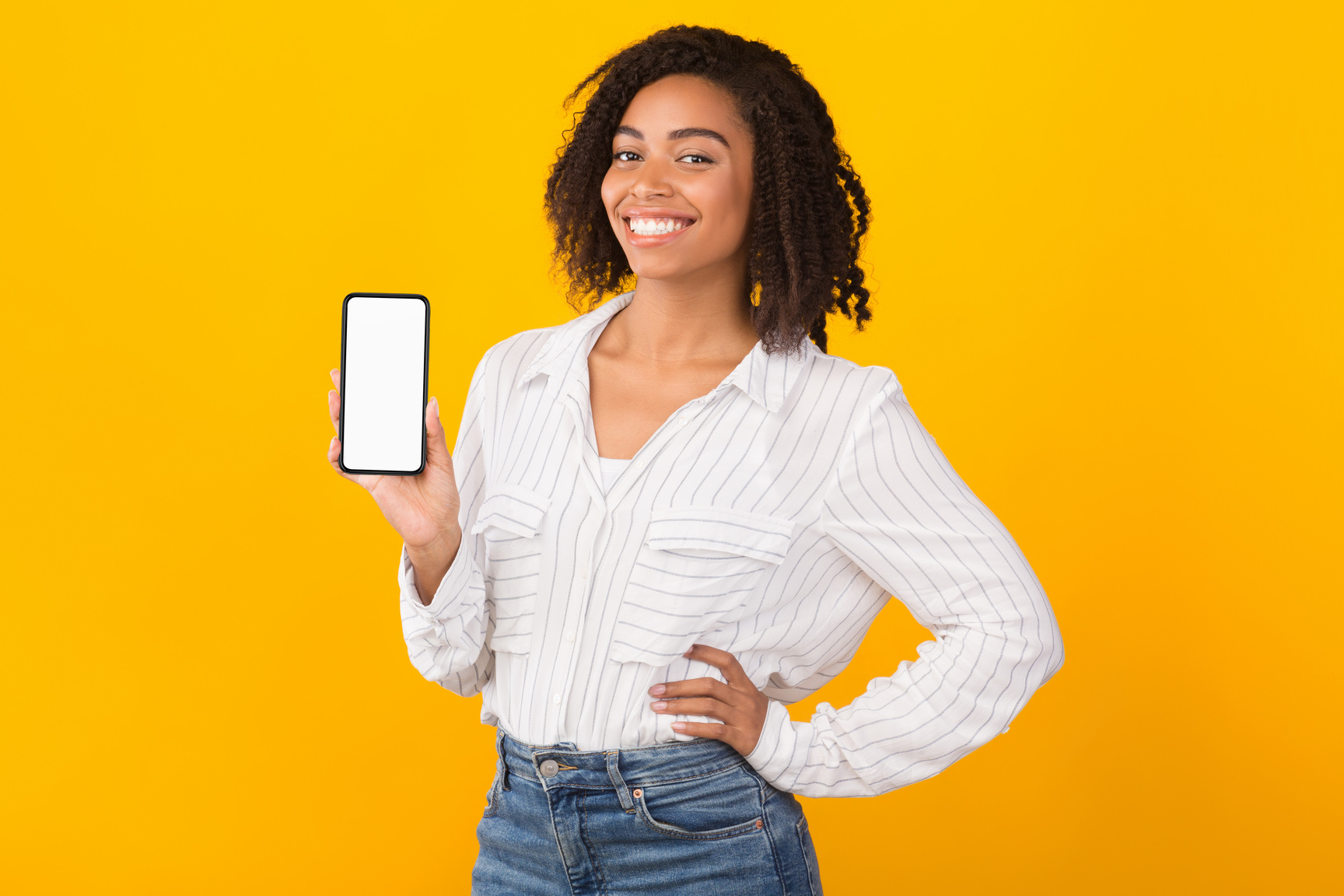 Smiling afro woman showing new app on phone